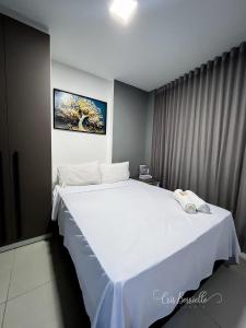 a bedroom with a large white bed in a room at Skylux 405 e 603 in Rio de Janeiro +54 photos