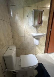 a bathroom with a toilet and a sink at Refúgio na Floresta in Manaus +48 photos