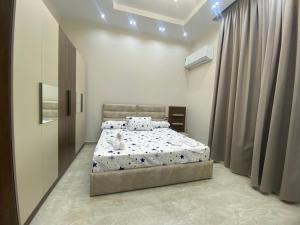 a bedroom with a bed with a dog on it at Luxury Apartments - Downtown Cairo in Cairo