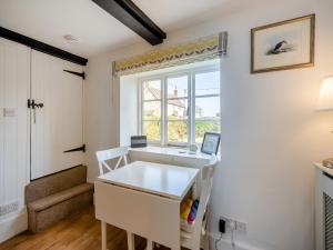 a room with a white desk and a window at No18 - Uk48248 in Sturminster Newton