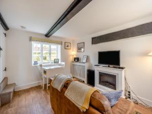 a living room with a couch and a fireplace at No18 - Uk48248 in Sturminster Newton
