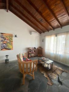 a living room with a couch and a table at Encanto Rural Keen in Luján