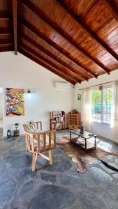 a living room with a couch and a table at Encanto Rural Keen in Luján