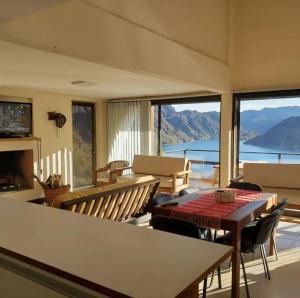 a living room with a table and chairs with a view at Las Marias in San Rafael +10 photos