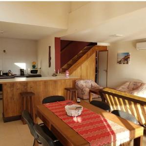 a kitchen and dining room with a table and chairs at Las Marias in San Rafael