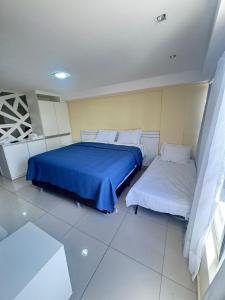 Postel nebo postele na pokoji v ubytování SUITE PREMIO CABO BRANCo