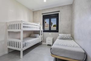 En eller flere senge i et værelse på Villa Infinity 1 + 18 billeder