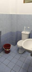 a bathroom with a toilet and a sink at BB Senawang Homestay in Seremban