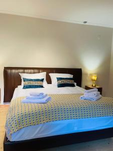 a bedroom with a bed with two towels on it at 2 Floor Rustic Inn in Dilijan in Dilijan +16 photos