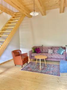 a living room with a couch and a table at 2 Floor Rustic Inn in Dilijan in Dilijan