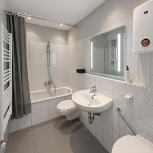 a white bathroom with a sink and a toilet at Köln Pulheim 48 in Pulheim
