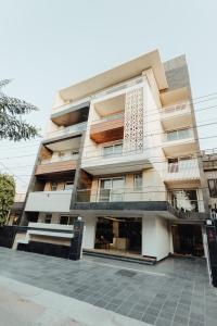 a tall building with a lot of windows at Hotel Keshav Residency - Medicity Gurugram, near Medanta Hospital in Gurgaon