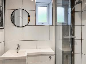a white bathroom with a sink and a mirror at Studio On The Green - Uk48298 in Chinley