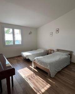 Ένα ή περισσότερα κρεβάτια σε δωμάτιο στο La casina sulla valle