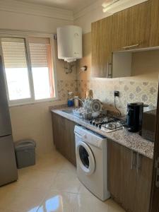 Kuchyň nebo kuchyňský kout v ubytování Appartement 2 chambres meublé Marrakech