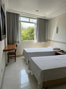 Ένα ή περισσότερα κρεβάτια σε δωμάτιο στο Hotel Rio Grande