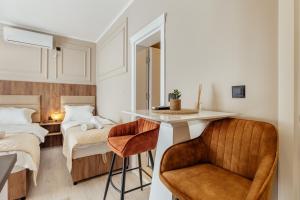 Giường trong phòng chung tại LuxA