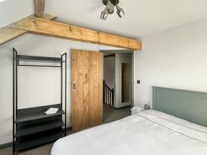 a bedroom with a bed and a ceiling fan at The Mill House Uk47418 in Curry Mallet