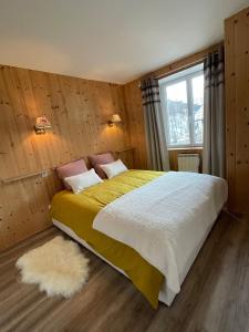 Кровать или кровати в номере Charmant appartement au coeur de Val Cenis