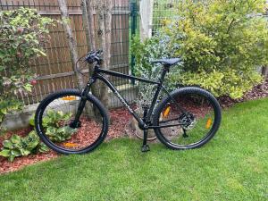 a bike parked in the grass in a yard at Villa Aselva with Pool near Kamenjak Nature Park in Premantura