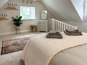 Postel nebo postele na pokoji v ubytování Rectory Cottage + 2 fotografie
