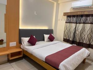 Ένα ή περισσότερα κρεβάτια σε δωμάτιο στο Hotel jagdish palace +8 φωτογραφίες