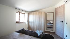 a bedroom with a bed and a mirror at Terminal7-Skyline in Ciampino