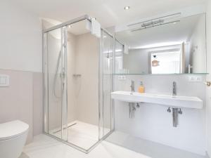 a bathroom with a shower and a toilet and a sink at Stöffler Haus Top 2 in Tamsweg +71 photos