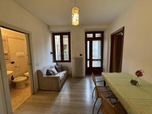 a living room with a couch and a table at Luca's Home - a due passi dal Centro Storico in Como