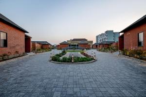 Κήπος έξω από το The Bhagwati Cottage & Villa