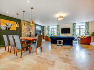 a dining room and living room with a table and chairs at Old Barn 1 - Uk48477 in Ferndown