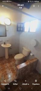 a bathroom with a toilet and a sink at Cabañas DondeJosé in Valle de Anton