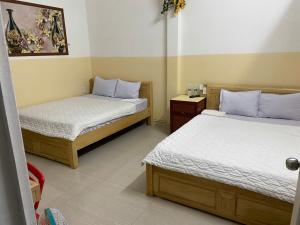 Ένα ή περισσότερα κρεβάτια σε δωμάτιο στο Hotel Sơn Duyên