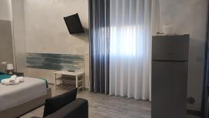 Televiisor ja/või meelelahutuskeskus majutusasutuses B & B LE GEMELLINE +50 fotot