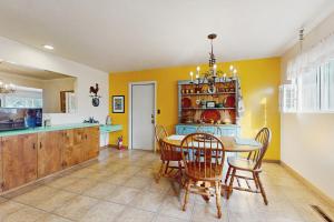 a kitchen and dining room with a table and chairs at West End Wanderlust in Eureka