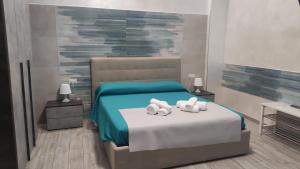 Voodi või voodid majutusasutuse B & B LE GEMELLINE toas