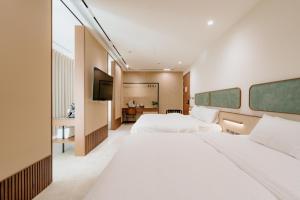 Postel nebo postele na pokoji v ubytování SunMoon Villa