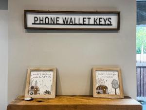a sign that reads phone walled keys sitting on a shelf at Cracken Cottage - Uk48297 in Chinley