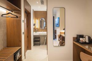 a bathroom with a sink and a mirror at Moontels Colón in Valencia +94 photos