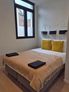 Ένα ή περισσότερα κρεβάτια σε δωμάτιο στο Huis ALNA 10