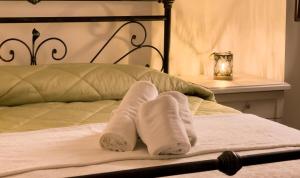 Una cama o camas en una habitación de Sardinian Gallery Sa Piatta