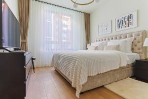 Postel nebo postele na pokoji v ubytování The Sensation Belgrade Waterfront