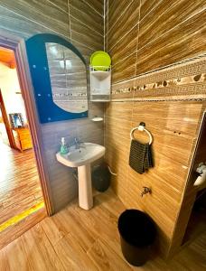 a bathroom with a sink and a mirror at beachfront house in Taghazout