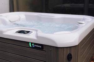 a white bath tub with water in it at Domaine des Terres du Val in Wanze
