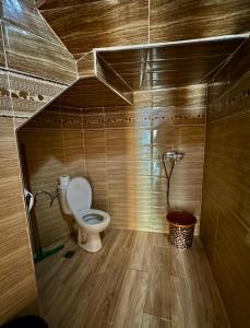 a bathroom with a toilet in a stall at beachfront house in Taghazout +18 photos