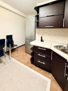 Η κουζίνα ή μικρή κουζίνα στο Cozy +7 φωτογραφίες