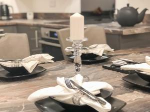 a candle sitting on a table in a kitchen at Sea View Penthouse - Regency Mansion in Redcar
