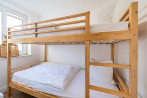 En eller flere senge i et værelse på Appartement Schmale Heide