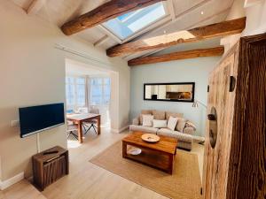 Televiisor ja/või meelelahutuskeskus majutusasutuses Appartement Halbinsel Mönchgut