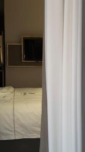 Postel nebo postele na pokoji v ubytování Rek Holiday Hotel